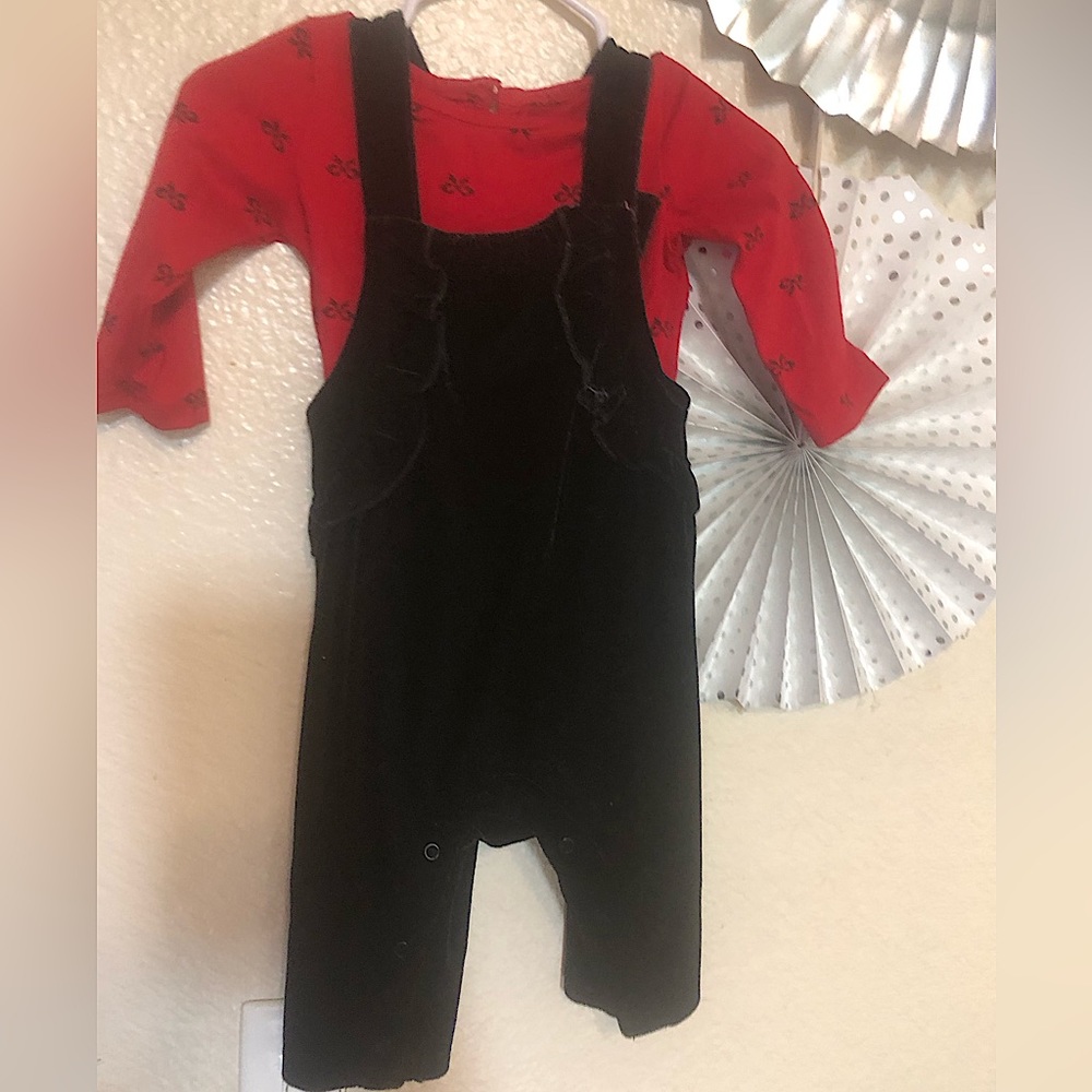 Black romper with a red w/ black bows under it !!!